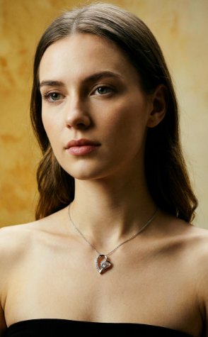 Woman wearing a Forever Love heart pendant necklace on a warm gold background