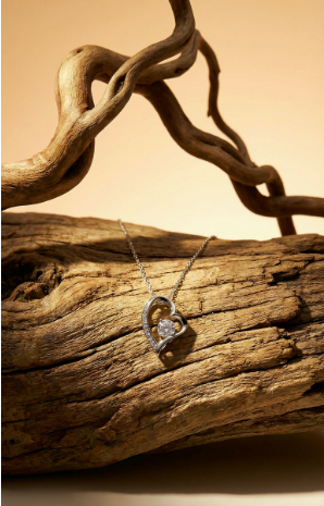 Forever Love heart pendant necklace displayed on natural wood background